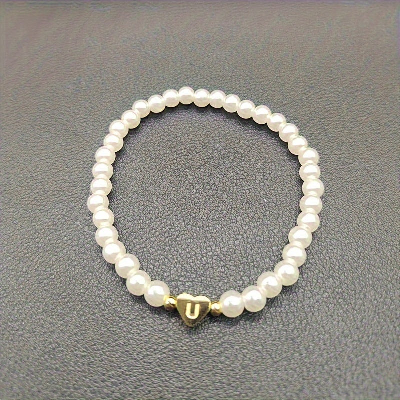 Elegantne käevõru südamekujulise initsiaaliga (A–Z)