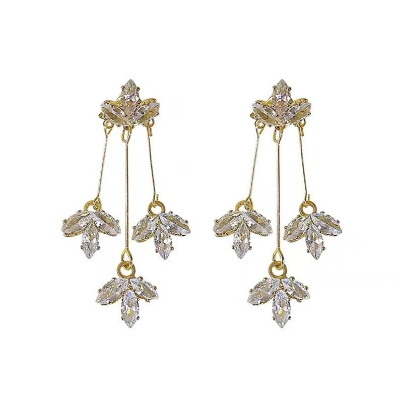 Maple's dangling flower-shaped earrings