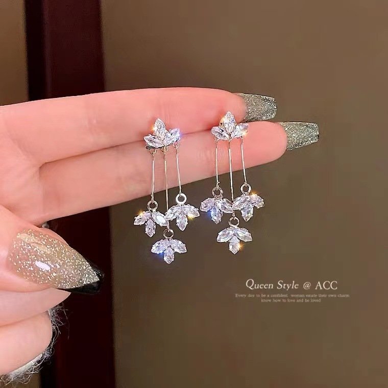 Maple's dangling flower-shaped earrings