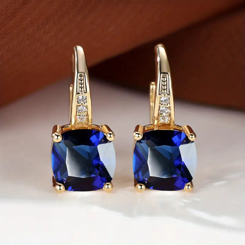 Hoop earrings with a mystical stone and sapphire | Gold