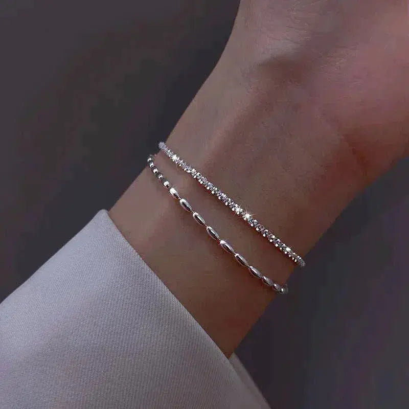 Elegantne hõbedane käevõrude komplekt tsirkoonidega